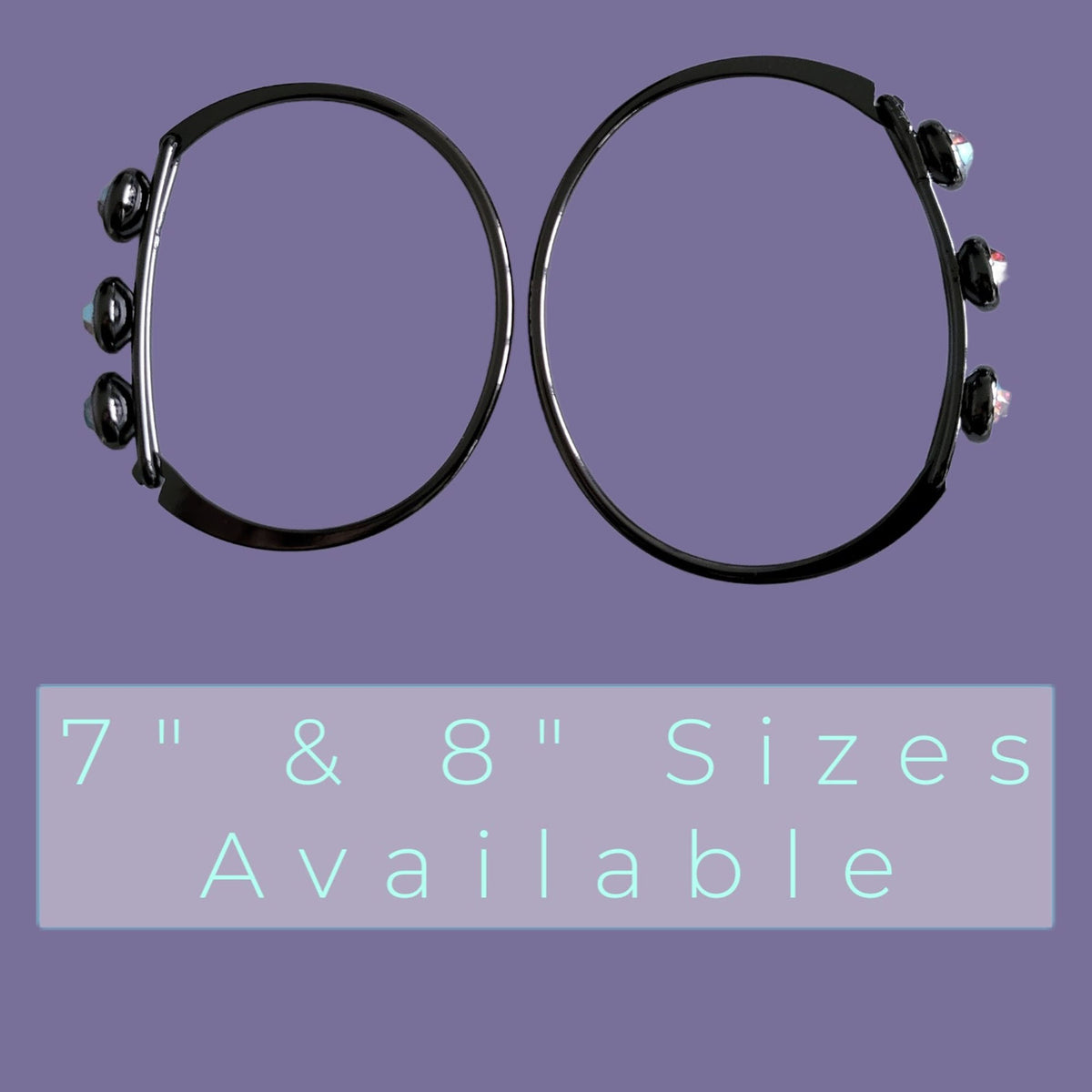 Two black circular hoop-style accessories with small clear and silver bead-like accents at the ends, shown on a purple background with text reading '7" & 8" Sizes Available'.